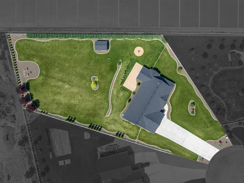 Drone aerial view of a luxury estate in Caldwell, Idaho, displaying property boundaries, landscape design, and lot size for real estate marketing and mapping.