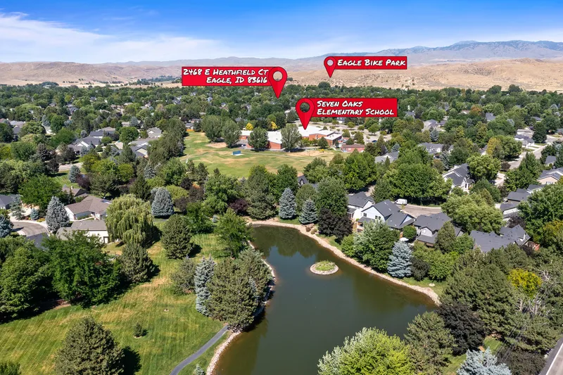 Aerial view of an Eagle, Idaho neighborhood with location markers identifying 2468 E Heathfield Ct, Seven Oaks Elementary School, and Eagle Bike Park, showing proximity to local amenities.